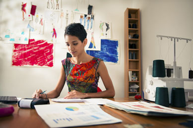 Woman Adding Up Costs of Crafting