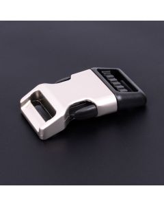 A half pearl silver nickel, half black plastic buckle on a dark background