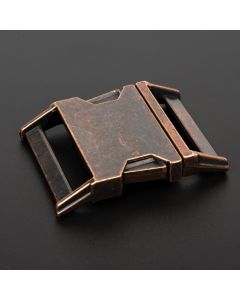 Antique Copper buckle with a black background