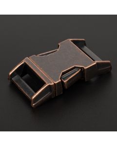 Aged copper buckle with black background