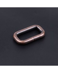 1 Inch Antique Copper Heavy Welded Rectangle Ring on a dark background