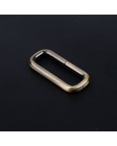 1 1/2 Inch Brushed Brass Heavy Welded Rectangle Ring with a dark background
