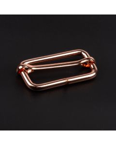 1 1/2 Inch Rose Gold Metal Sliding Bar Triglide Buckle shown on a dark background