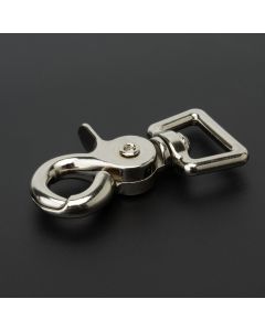 A nickel trigger swivel snap on a black background