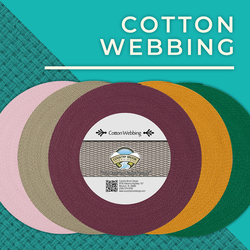 Cotton Webbing. 5 rolls of cotton webbing in a variety of colors stacked.