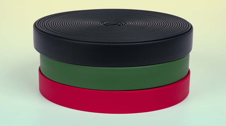 A stack of coiled and coated PVC webbing accentuates the smooth leather like finish.
