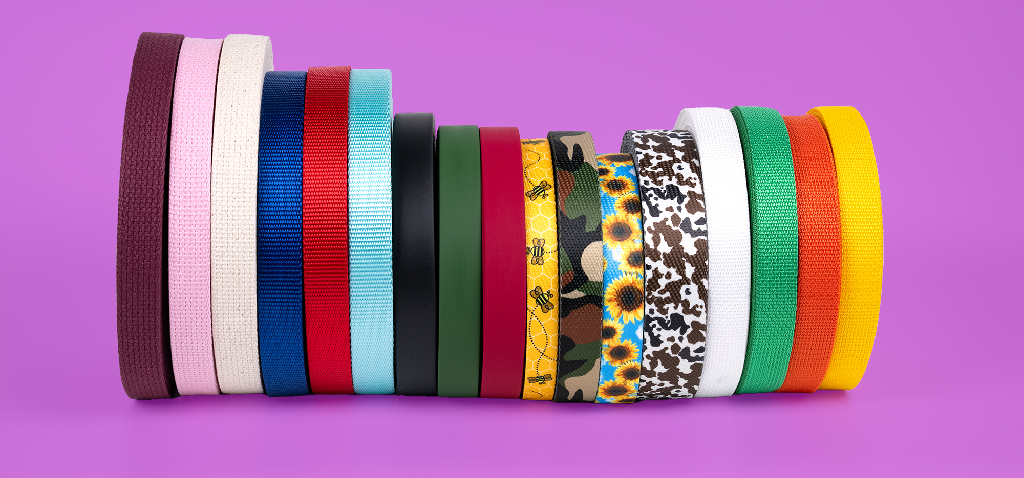 Assortment of different styles of colors, and patterns of polyester, cotton, polypropylene and PVC webbing.